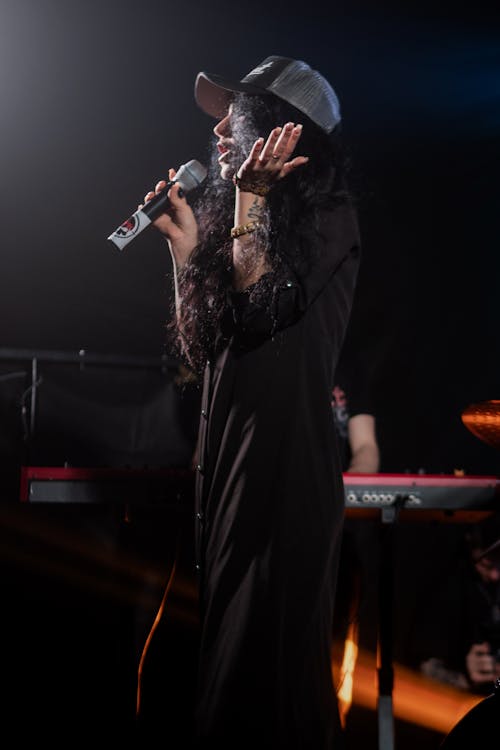 Woman Holding a Microphone