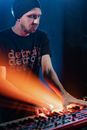 Man in Black Crew Neck T-shirt Playing Music with an Electronic Keyboard