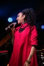 Woman in Pink Dress Singing