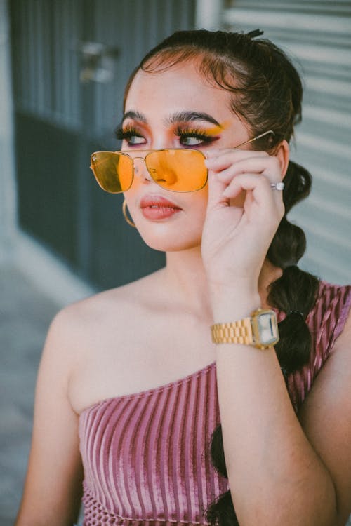 Free A Pretty Woman Wearing Sunglasses Stock Photo