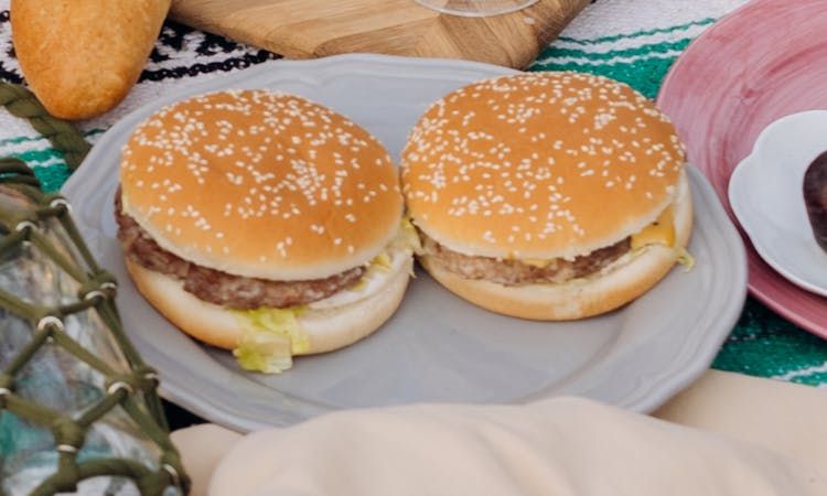 Burgers On White Ceramic Plate