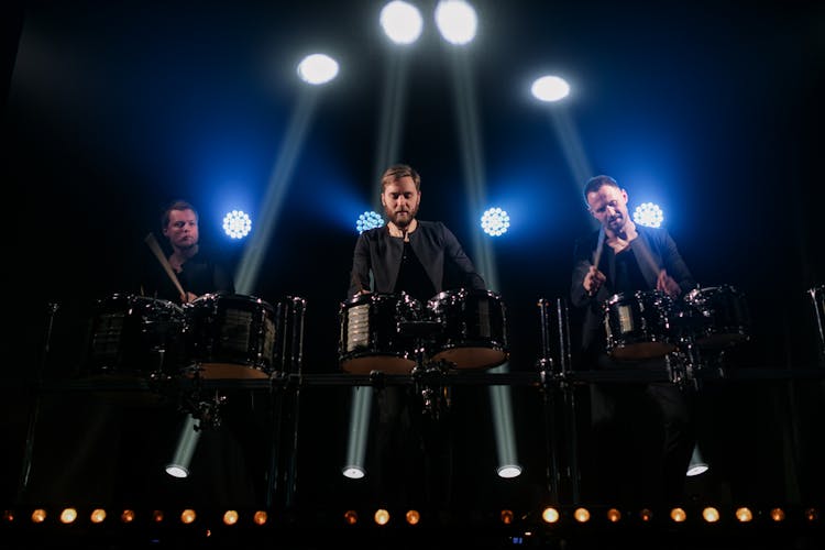 Men Performing Live Music With Drums