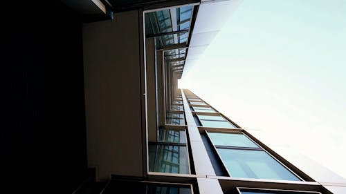 Free A Low Angle Shot of a Building with Glass Panels Stock Photo