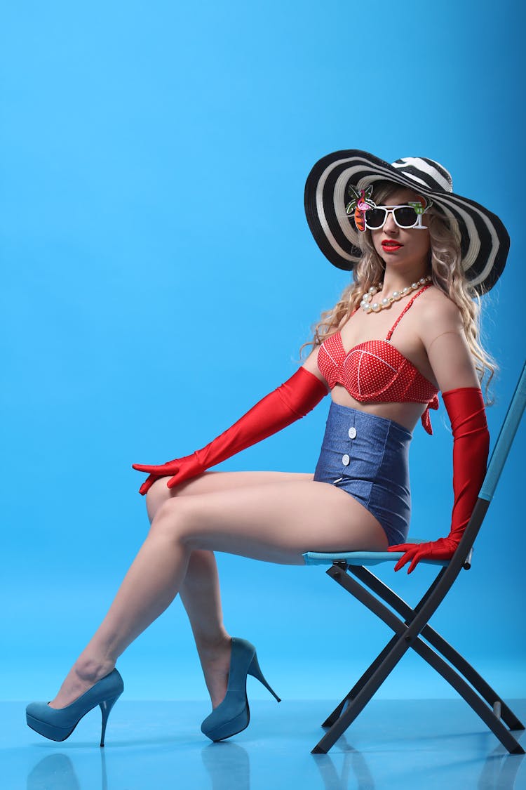 Sensual Woman In Beach Outfit Sitting On Chair