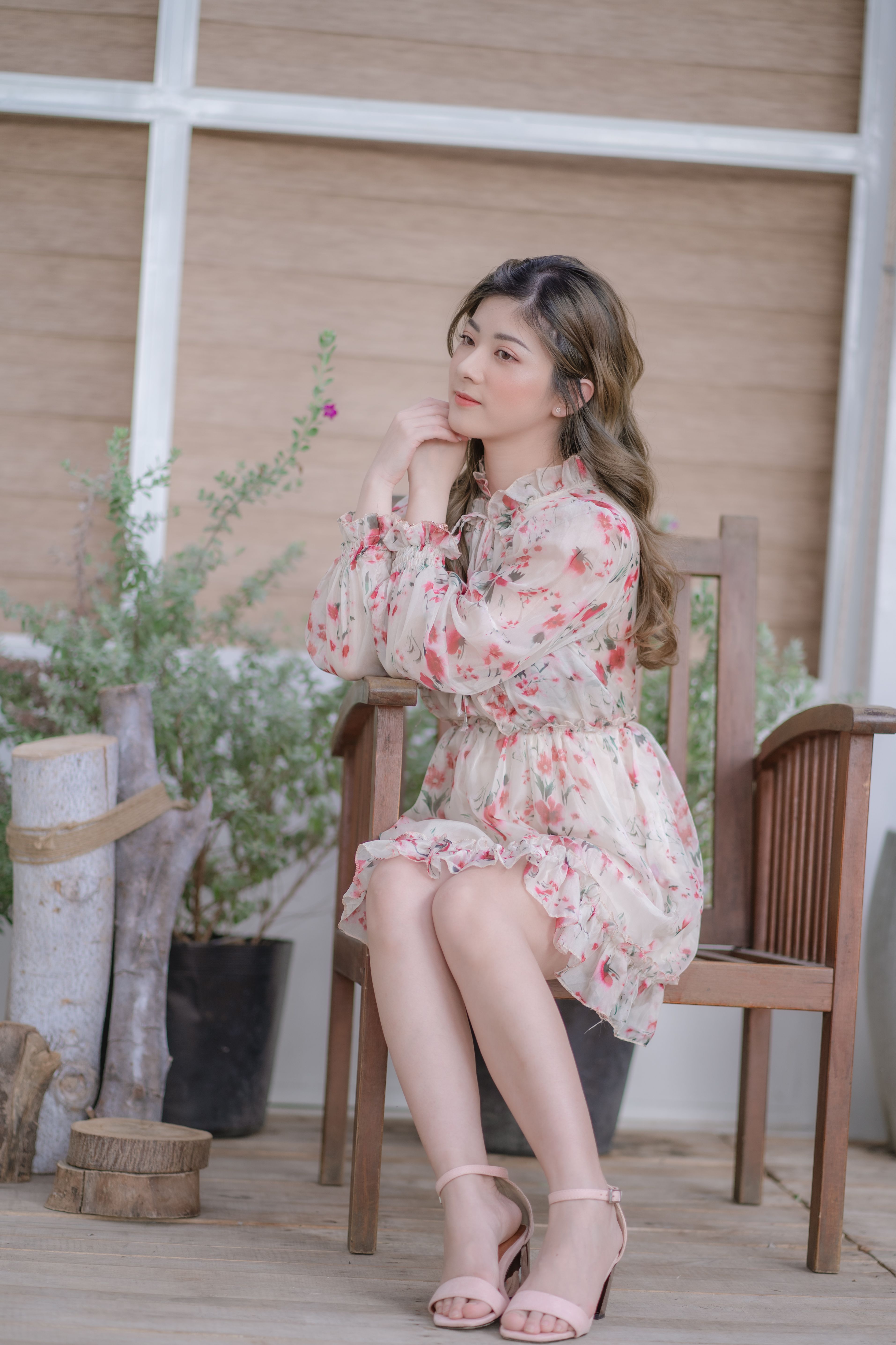 A Woman in Floral Dress Sitting on the Chair · Free Stock Photo