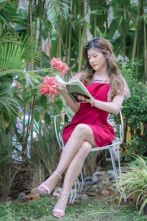 Photograph of a Woman in a Red Dress Reading a Book · Free Stock Photo