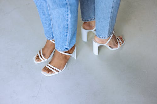 Women Wearing White High Heels 