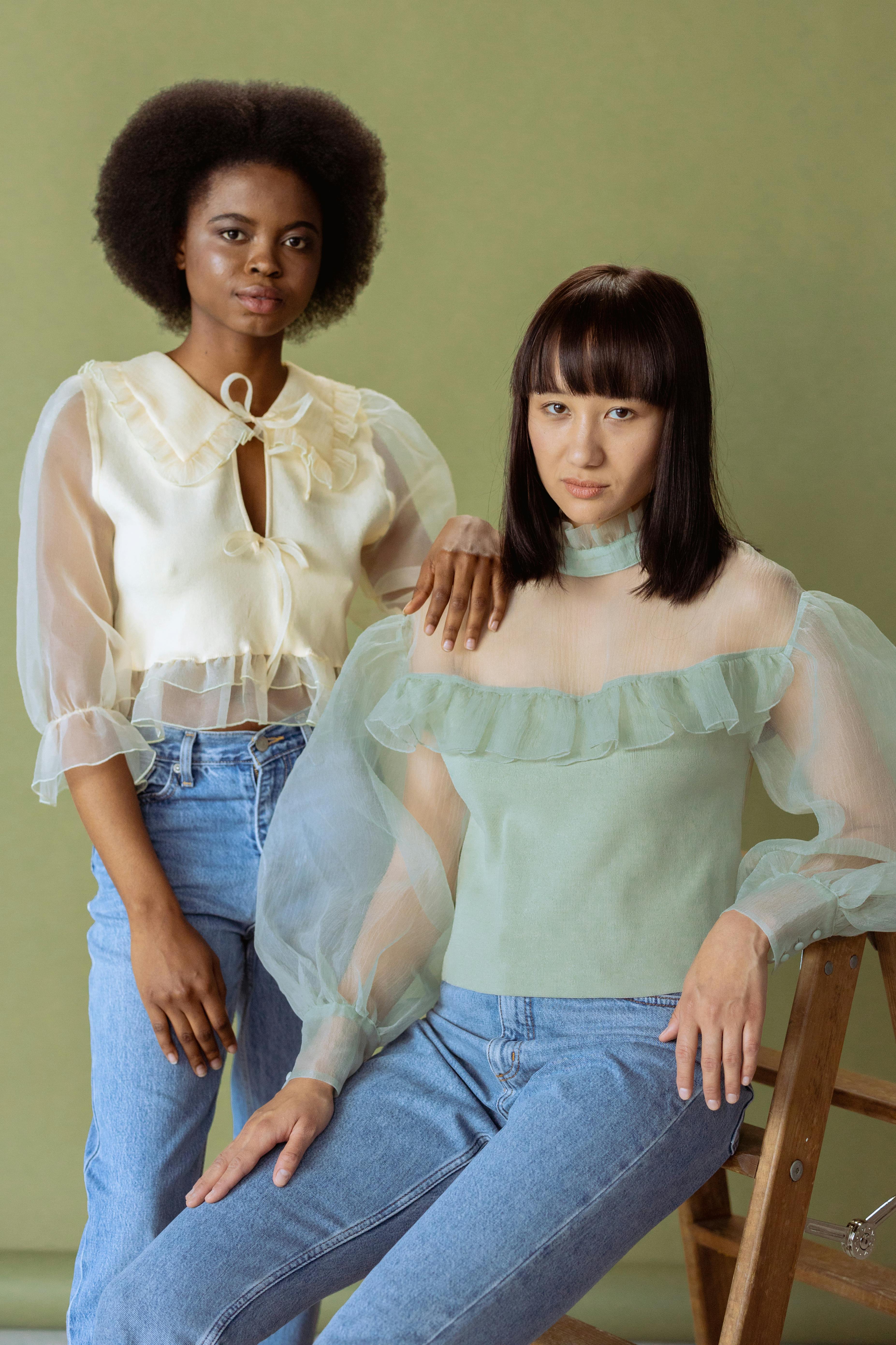 women in sheer blouses