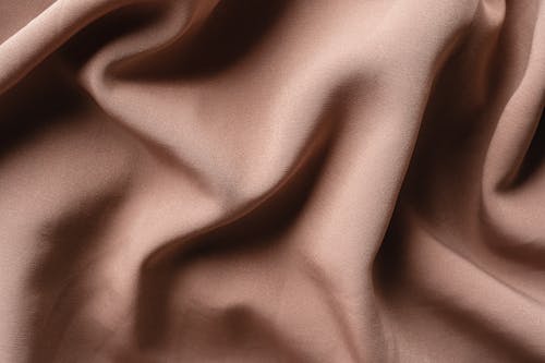 Close-Up Shot of Brown Textile