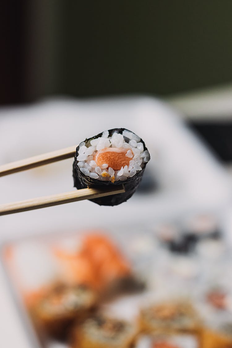 A Chopsticks With Sushi Roll
