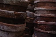 Close Up Photo of Pile of Brown Clay Pots