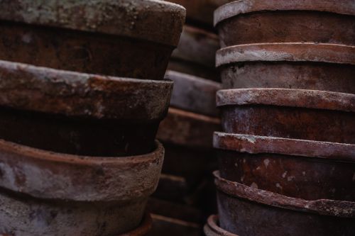 Free Detailed view of rustic earthenware pots stacked closely together, showcasing texture and craftsmanship. Stock Photo