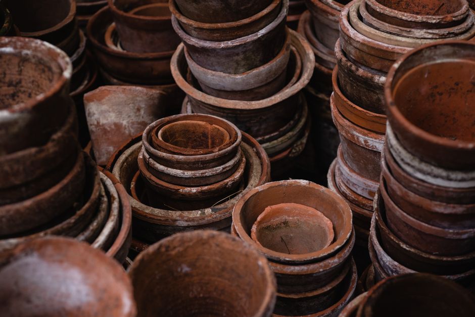 A collection of stacked earthenware pots showcasing rustic craftsmanship and texture.