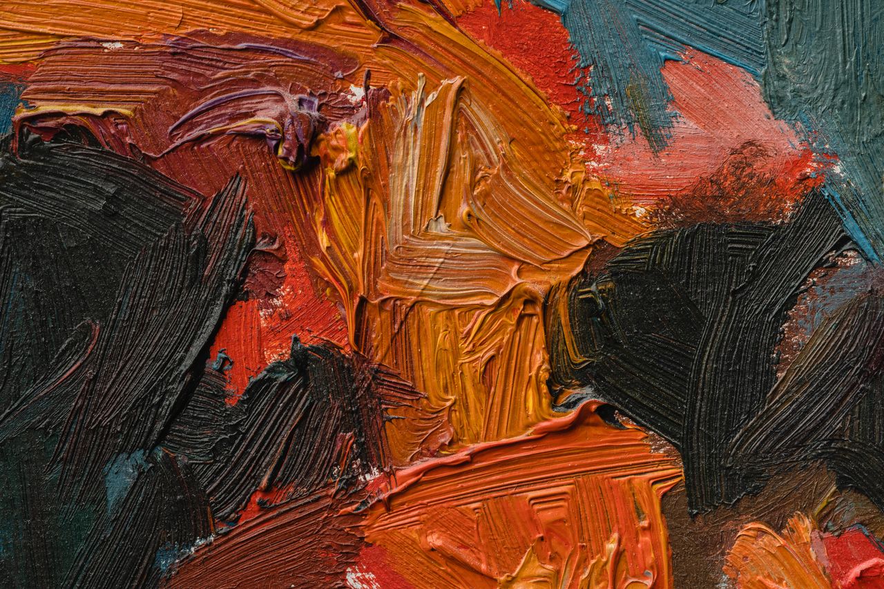A macro (close-up) photo of "impasto" paint—thick, visible ridges of oil paint that look like they could be touched.