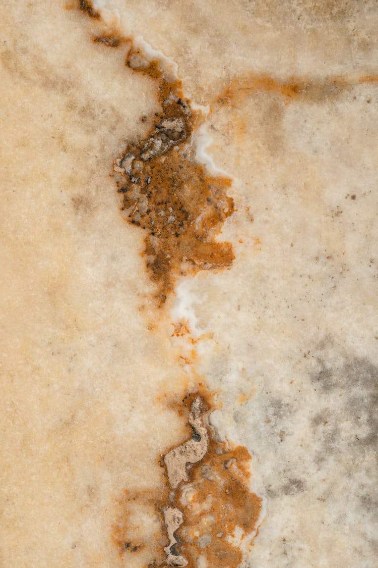 Close-Up Photo Of A Brown Marble Surface