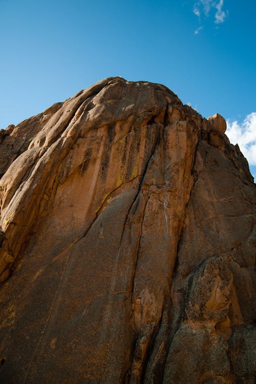 Low Angle Photo of Brown Rock Formation Under Blue Sky