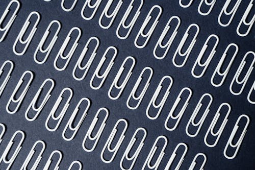 Free Close-Up Shot of White Paper Clips Stock Photo
