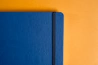 Blue Notebook on Yellow Surface