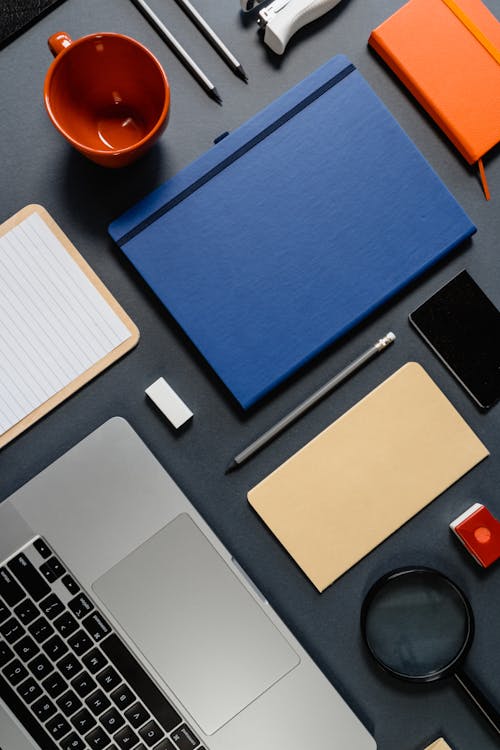 A Flatlay of a Laptop and Office Supplies