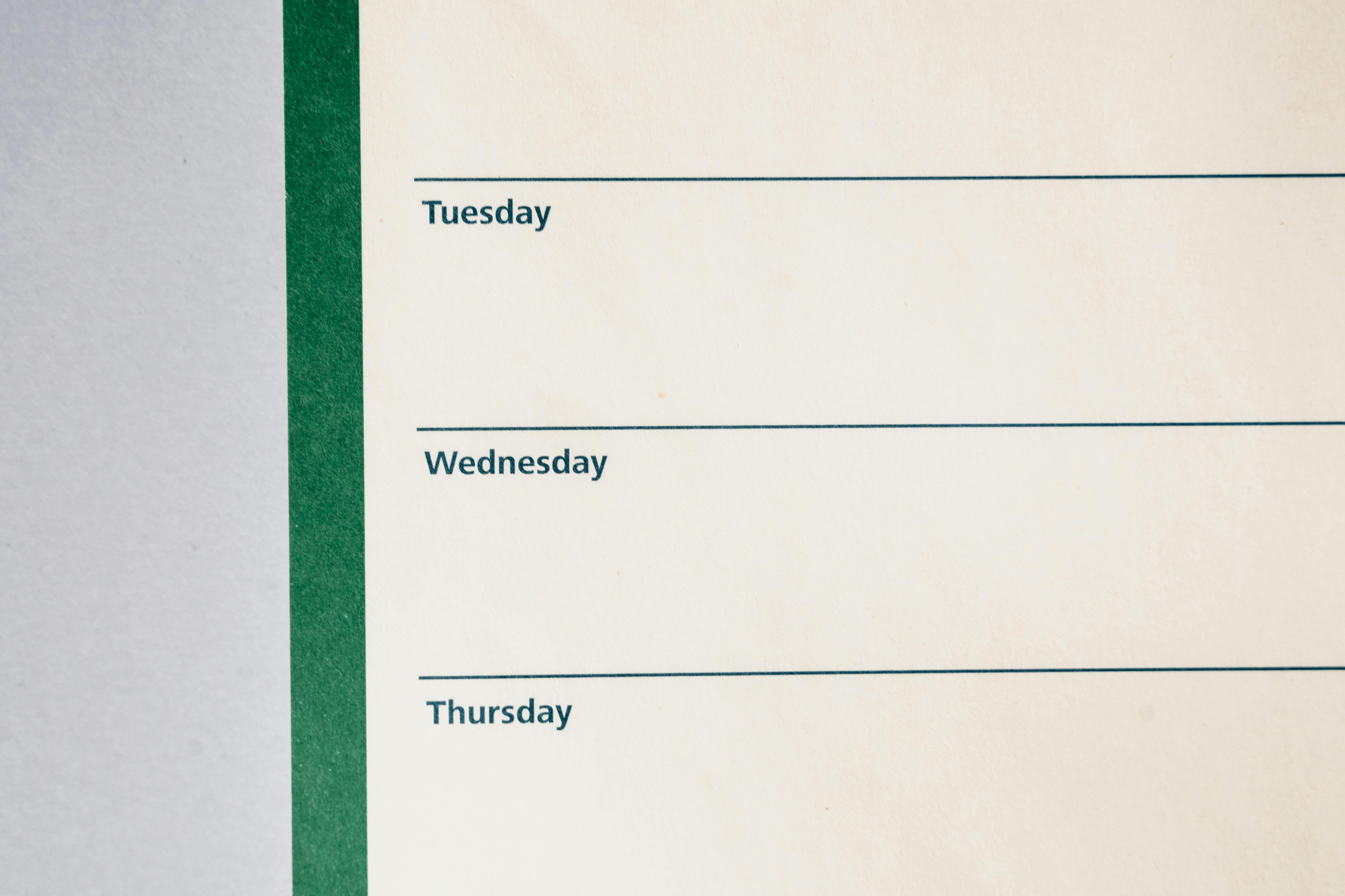 Close-up view of a minimalist weekly planner featuring days of the week.