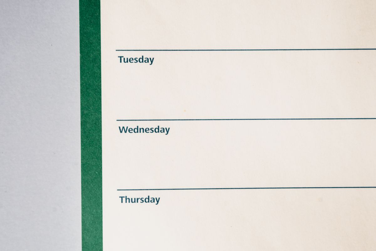 A minimalist weekly planner showing the days of the week