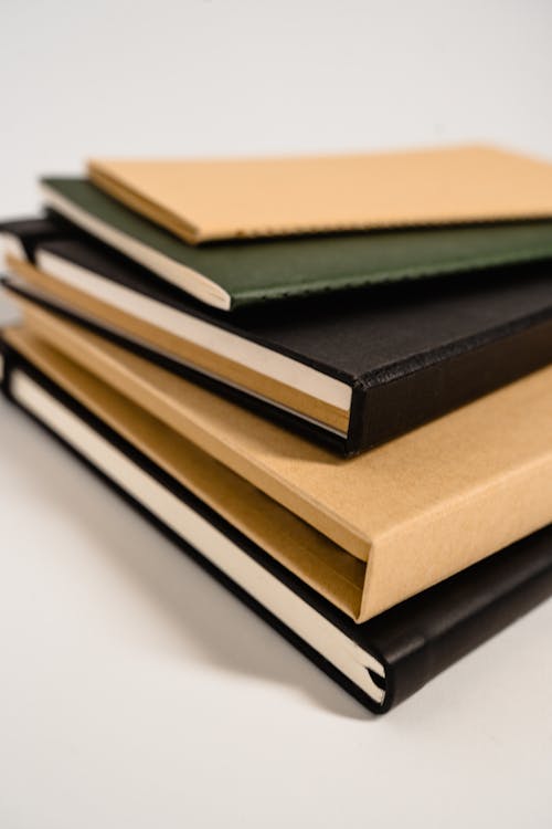 Brown and Black Hardbound Books