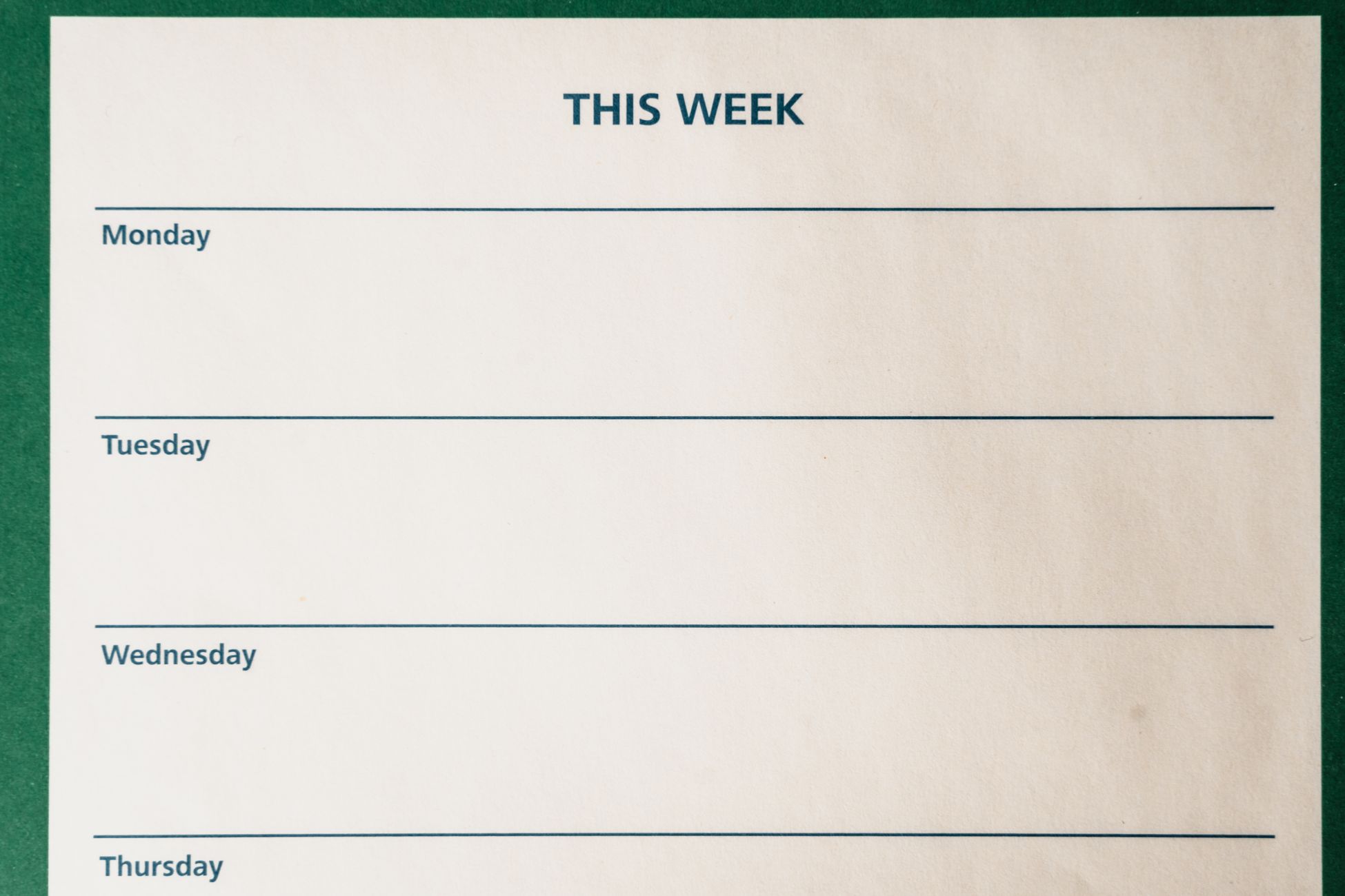 Minimalist blank weekly planner with days for scheduling and organizing tasks.
