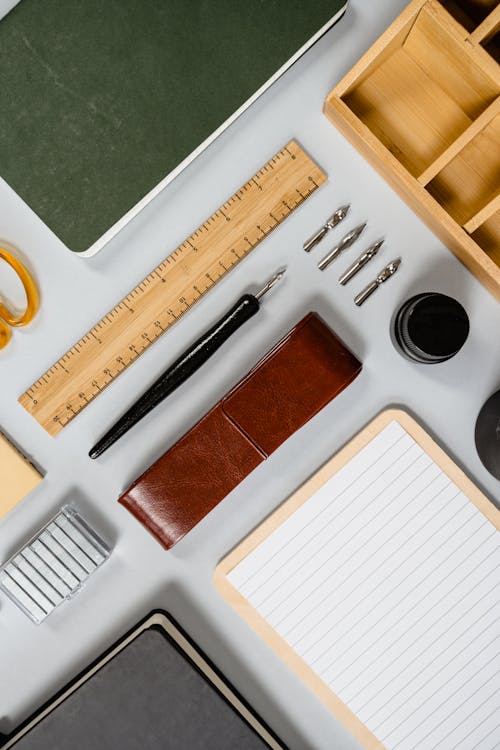 Stationery and Wooden Box on White Background