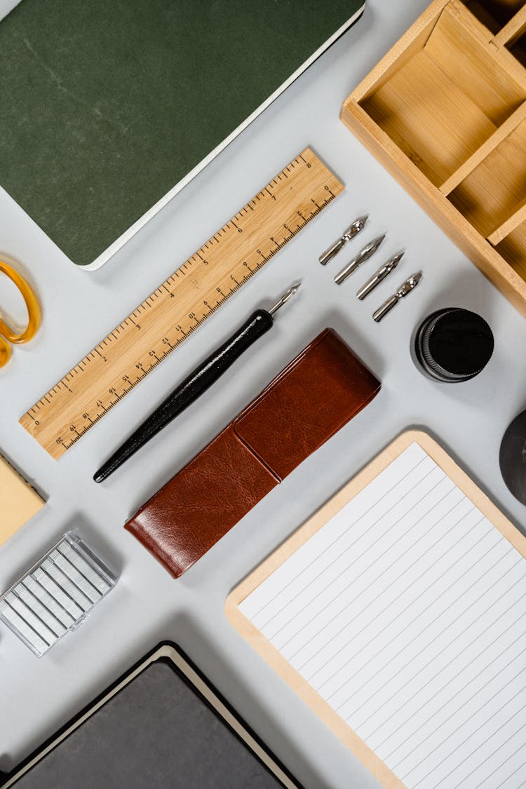 Stationery And Wooden Box On White Background