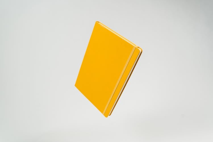 Photo Of A Yellow Notebook