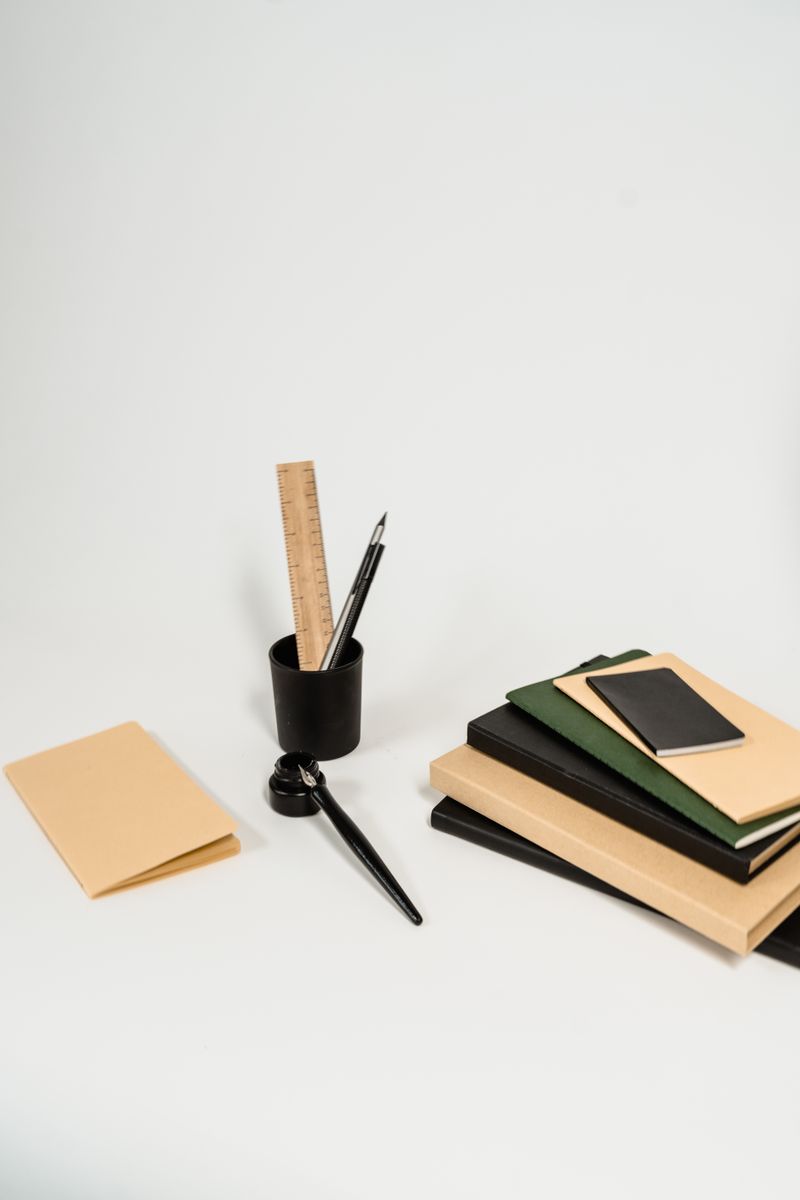 Notebooks and pens arranged on a desk
