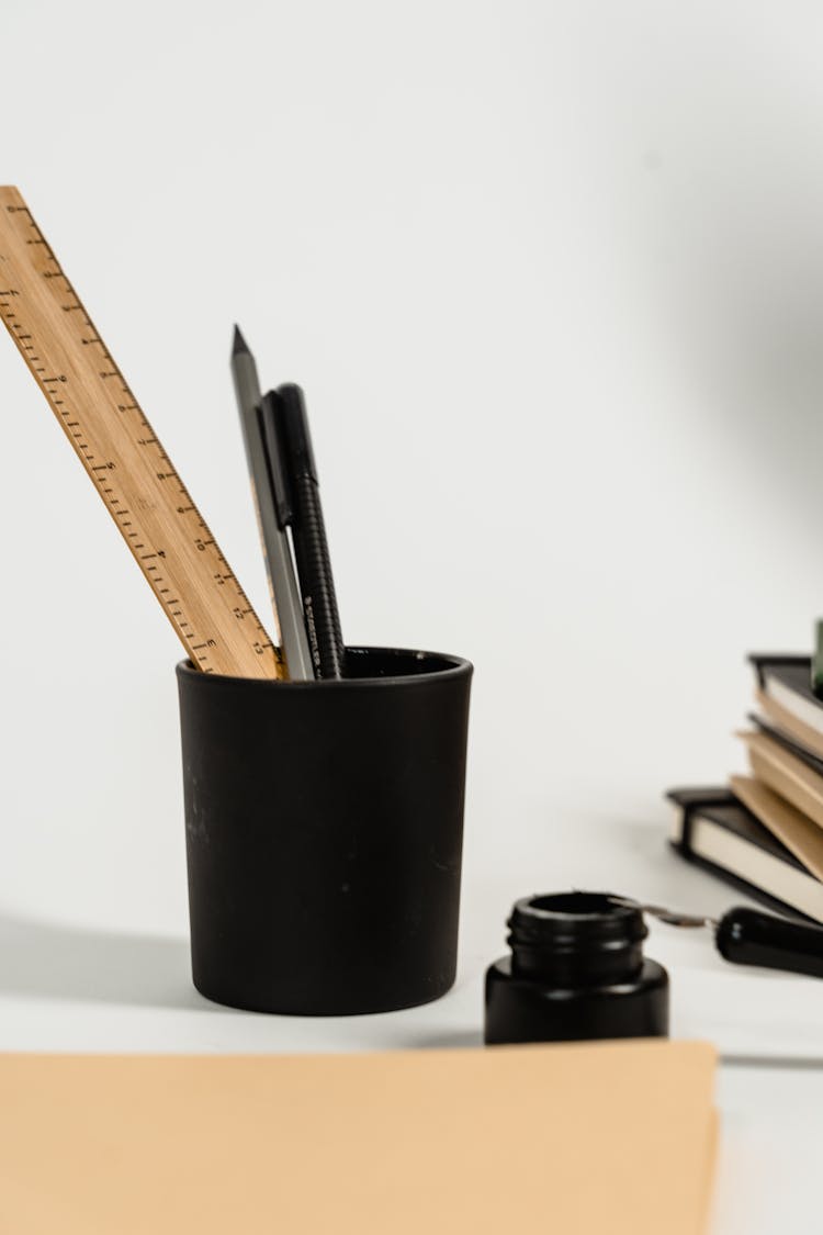 Pens And Ruler In A Cup Holder