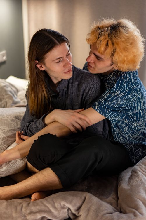 Free Couple sharing a warm embrace indoors, reflecting love and togetherness. Stock Photo