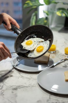 Hands serving sunny-side-up eggs on toast, a simple breakfast setup.