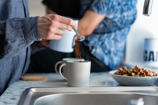 A serene morning scene of coffee preparation in a home kitchen.