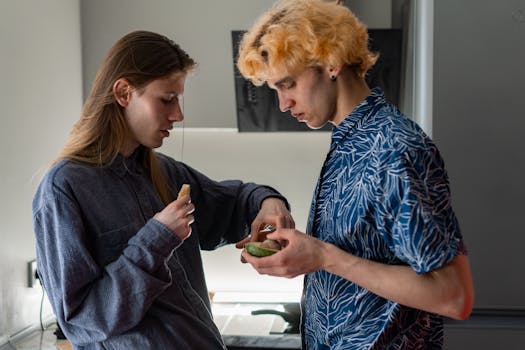 Two young men sharing breakfast in a cozy kitchen setting, highlighting morning routines and connection.