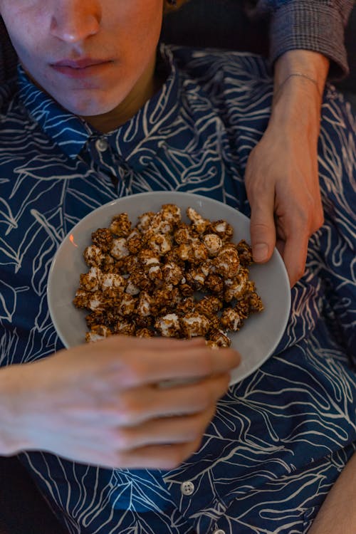 A Person Holding a Bowl of Popcorn