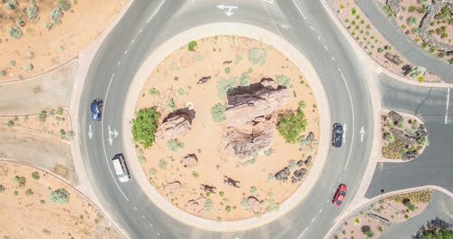 Aerial Photo of Four Cars on round about at Daytime