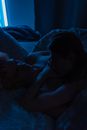 Man and Woman Kissing on Bed