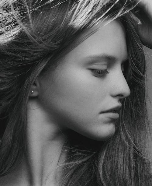 Grayscale Photo of a Woman's Side Profile