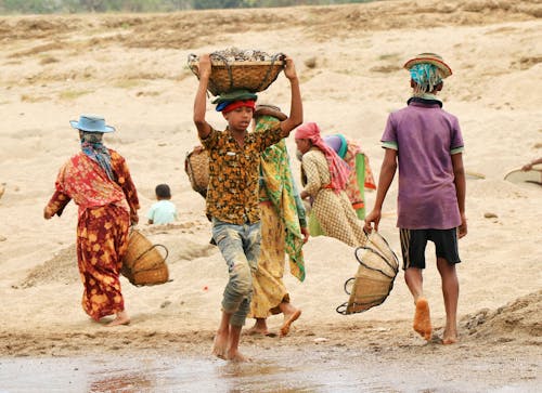 People Carrying Woven Baskets