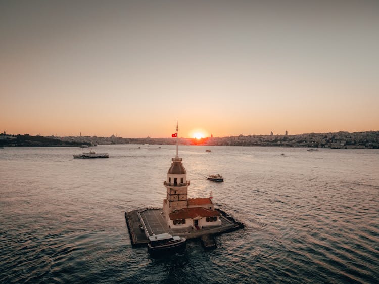 Lighthouse With A Flag On Tower