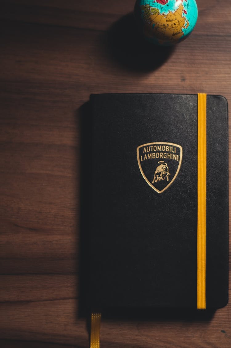 Lamborghini Moleskine Notebook And A Globe 