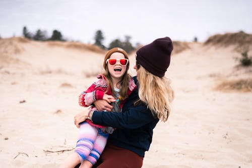 A Mother Carrying her Daughter