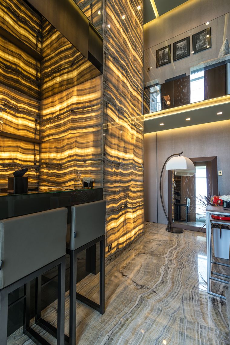 Grand marble-lined villa entrance hall with patterned marble flooring