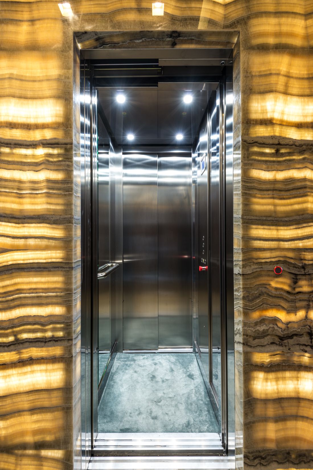 Stainless steel elevator cabin with premium wall and ceiling finishes