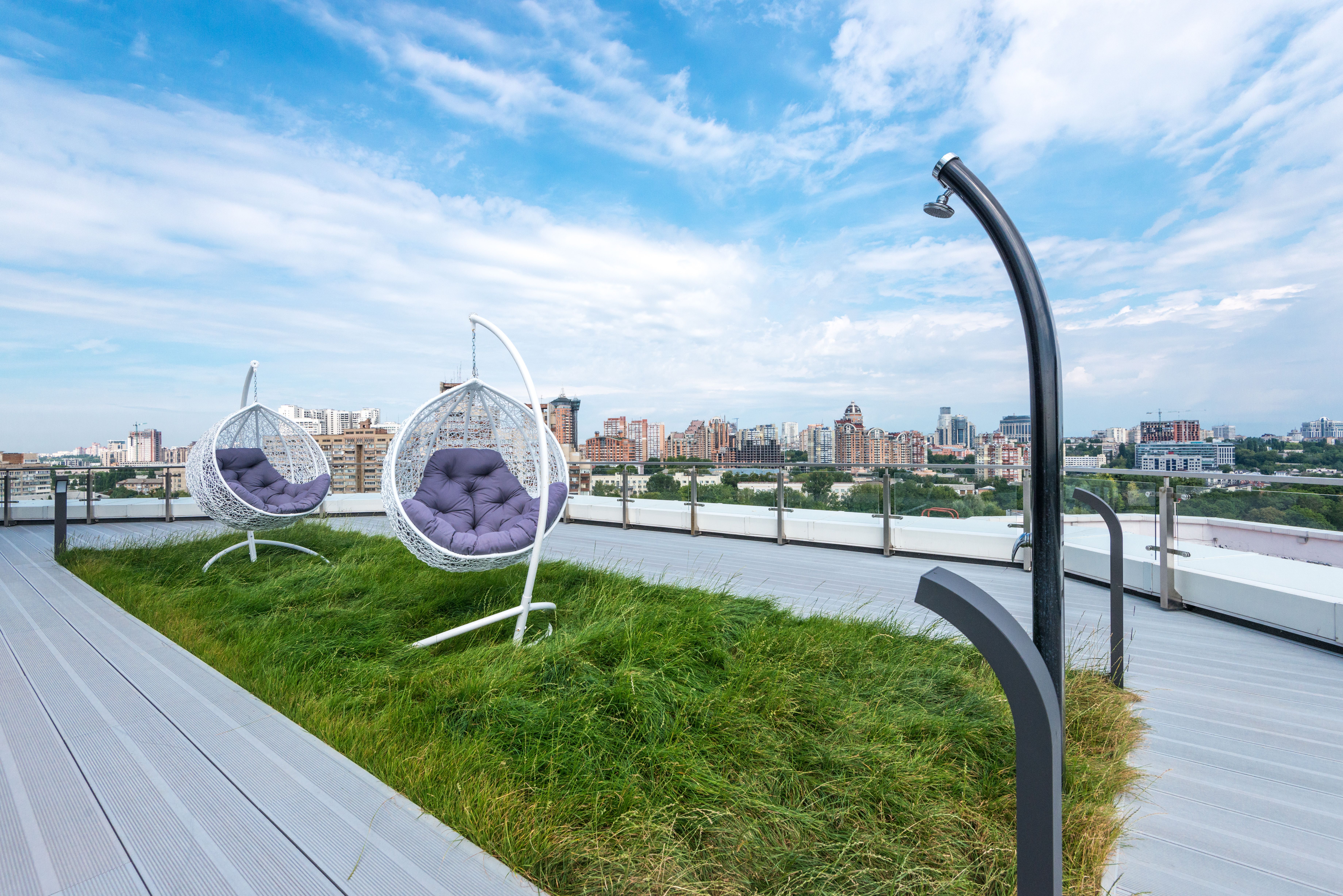 a stylish apartment rooftop deck with seating and city views - chicago flats for rent