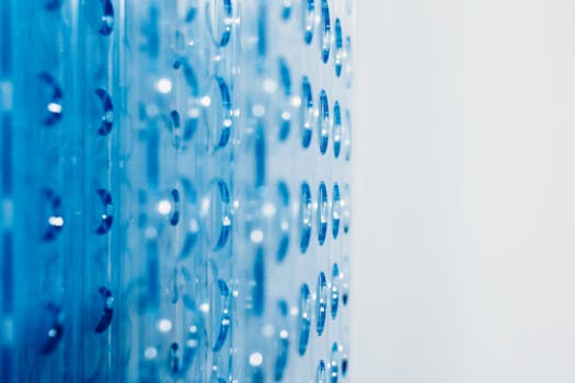 Close-up of an abstract blue surface featuring circular indentations creating a modern pattern.