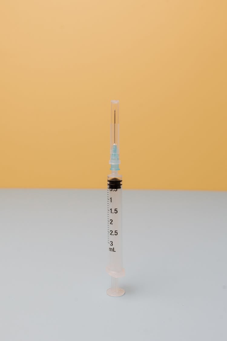 An Empty Syringe With Cap