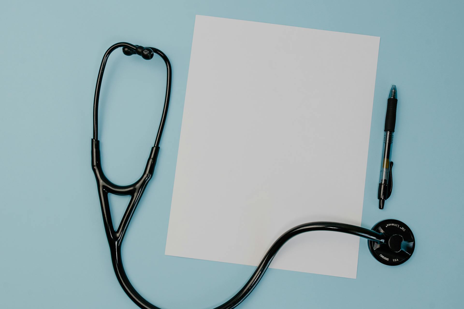 A Black Stethoscope on White Sheet of Paper
